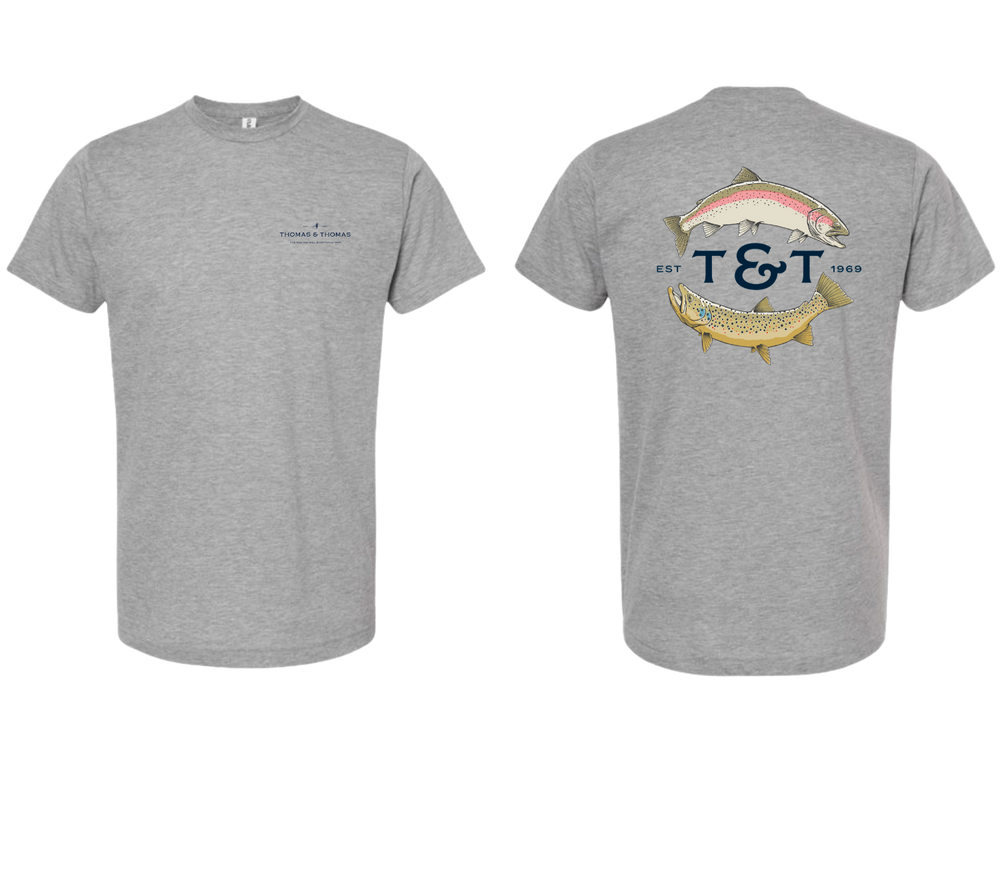 Thomas & Thomas Rods & Accessories - Two heather grey T&T trout tees, one with the front facing up and the other with the back facing up, showcasing the Thomas & Thomas logo and the T&T trout design on the back.
