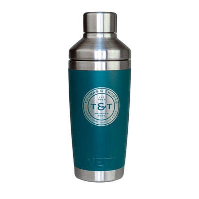 Teal 20oz YETI Tumbler with cocktail shaker lid and silver Thomas & Thomas Badge logo on the front. 