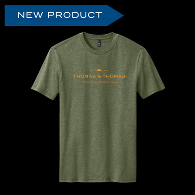 Front view of short sleeve heather green shirt with orange screen print writing of Thomas & Thomas logo with small text beneath saying "The Rod You'll Eventually Own"