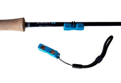 Blue Thomas & Thomas Mag Grab Rod Rack on Thomas & Thomas Exocett 88 8wt rod with blue accents and cork handle on a white background
