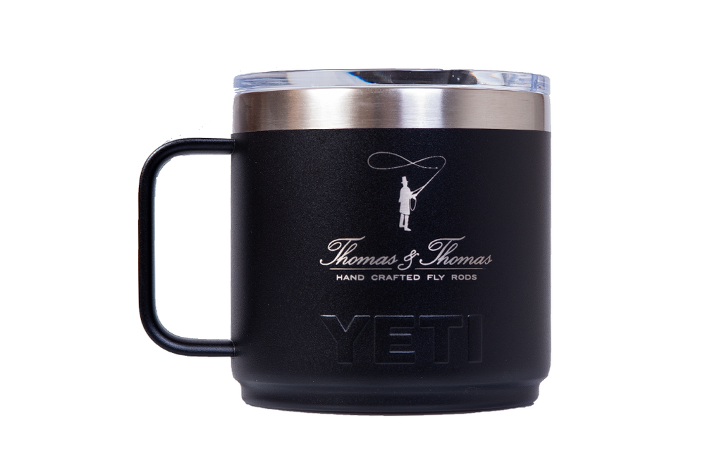 Thomas & Thomas Rods & Accessories - Black Yeti mug with silver rim and handle on a white background